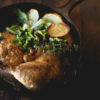 Bentwood Tavern in New Buffalo, Michigan, specializes in artisan comfort cuisine, like the Crispy Iron Chicken shown here. This dish features one half otto's natural chicken, lemon-thyme pan sauce, roasted yukon gold potatoes and sautéed escarole Half chicken roasted in a cast iron skillet with lemon-thyme pan sauce, roasted yukon gold potatoes and sautéed escarole