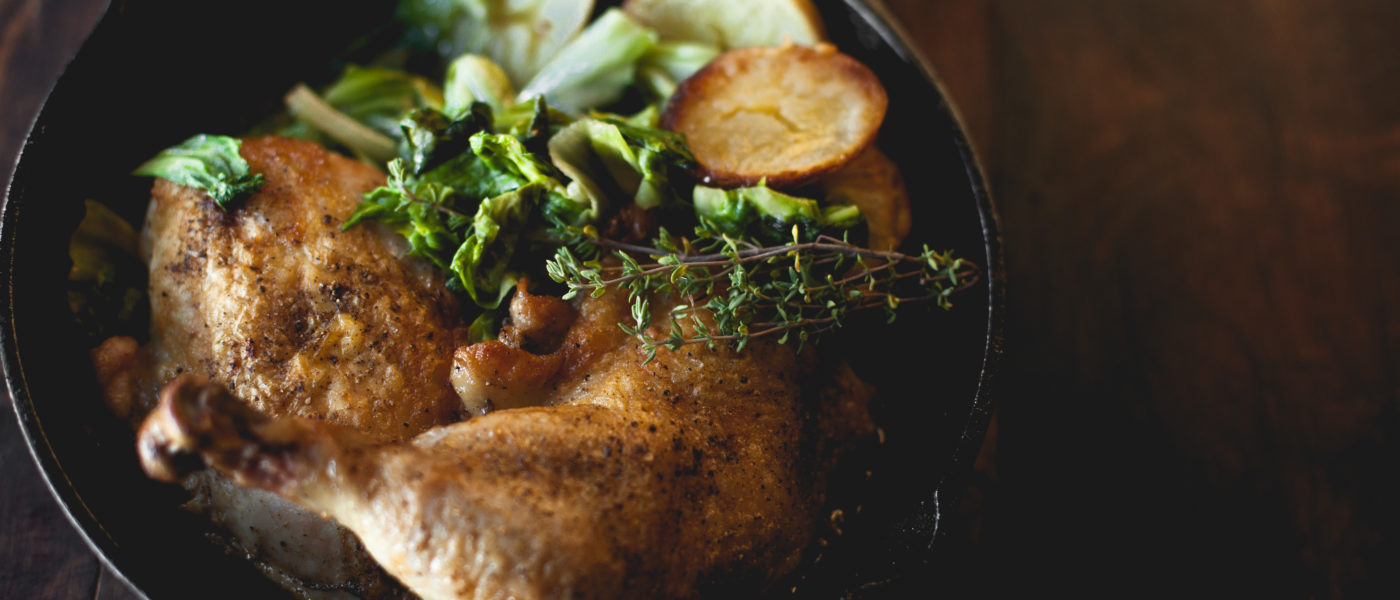Bentwood Tavern in New Buffalo, Michigan, specializes in artisan comfort cuisine, like the Crispy Iron Chicken shown here. This dish features one half otto's natural chicken, lemon-thyme pan sauce, roasted yukon gold potatoes and sautéed escarole Half chicken roasted in a cast iron skillet with lemon-thyme pan sauce, roasted yukon gold potatoes and sautéed escarole