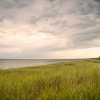New Buffalo Beach is a beautiful destination no matter the season or time of day. And, it's just a short 15-minute walk from Marina Grand Resort Cloudy beach grass view looking out over Lake Michigan in the early morning light