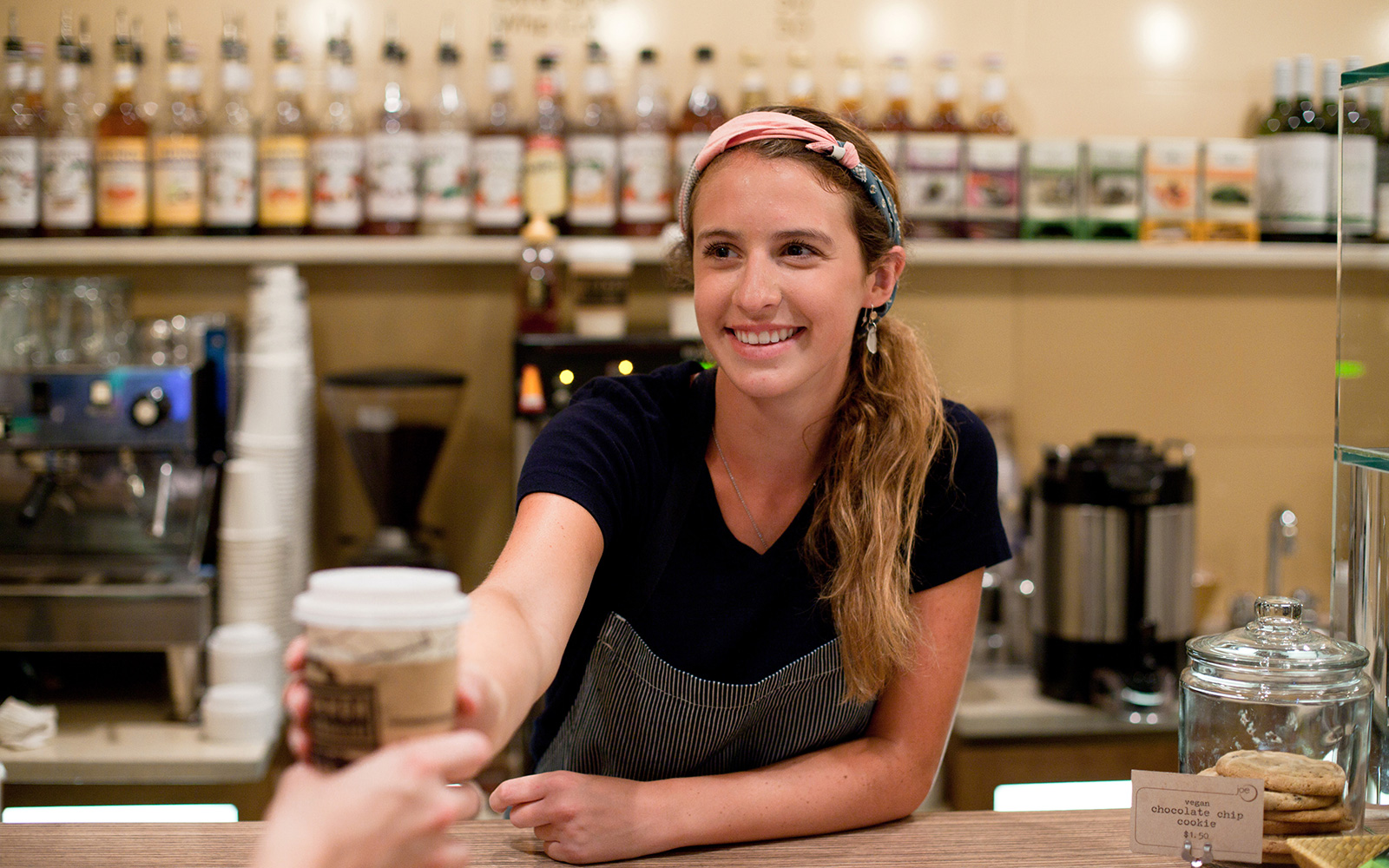 joe-barista Joe barista hands a cup of coffee to a guest