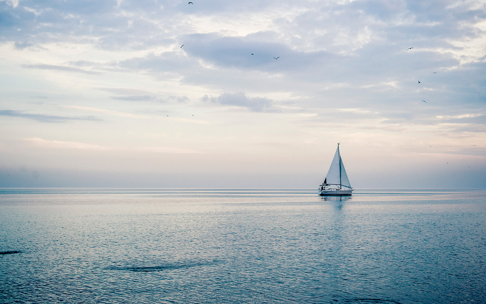 Lake Michigan view and a sailboat on the horizon