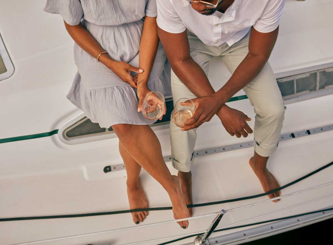 Couple with wine on boat at Marina Grand Resort, New Buffalo