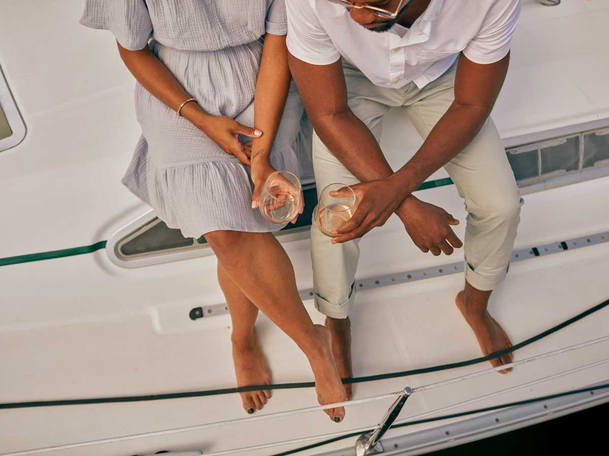Couple with wine on boat at Marina Grand Resort, New Buffalo